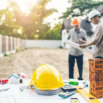 This image represents 2 construction engineers discussing the construction project